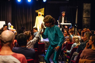 Bobbi (Alicia Gonzalez) getting help from the audience in You'll Never Guess Where I Hid the Cheese, Sydney Fringe 2017